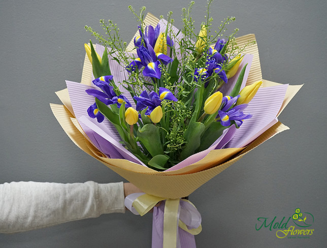 Bouquet of yellow tulips and irises photo